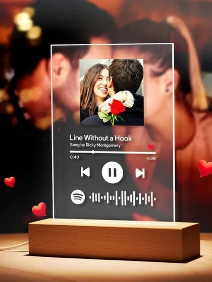 Capture your special song forever with a personalized music plaque. I engrave your photo and the song details onto a clear acrylic plaque with a wooden stand, creating a beautiful desk ornament that links directly to your music.