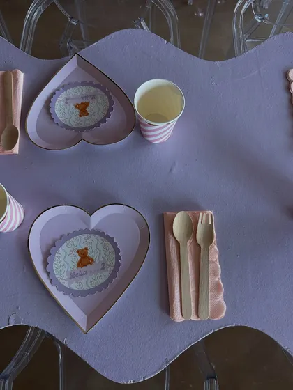A detailed look at the heart-shaped plates and custom teddy bear placemats from Leila's 2nd birthday party.