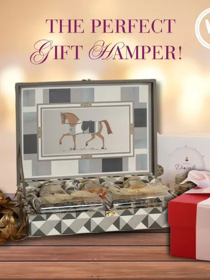 The perfect gift hamper for someone with classic taste. This image showcases the horse-motif box alongside a festive red gift box, suggesting it's ready to be presented for Diwali or another special occasion.