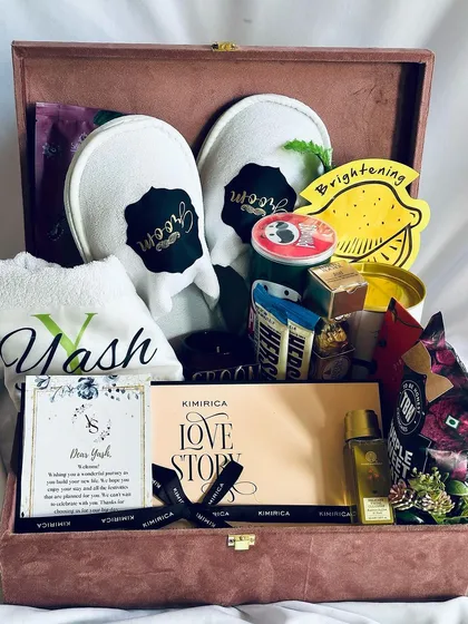 Celebrate the main man with our ultimate groom hamper. This personalized trunk includes custom monogrammed slippers and a towel for 'Yash', alongside premium grooming products and snacks, making it the perfect pre-wedding indulgence.