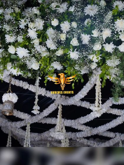 A close-up of the traditional bell mantap, showing the detailed floral work and hanging bell elements that give it a unique and classic look.