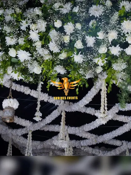 Another angle of the bell mantap, highlighting the combination of white florals and traditional elements.