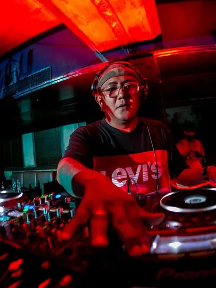 On the ones and twos at Raasta Delhi. The red lights and packed house create an intense vibe that I feed off of all night long.
