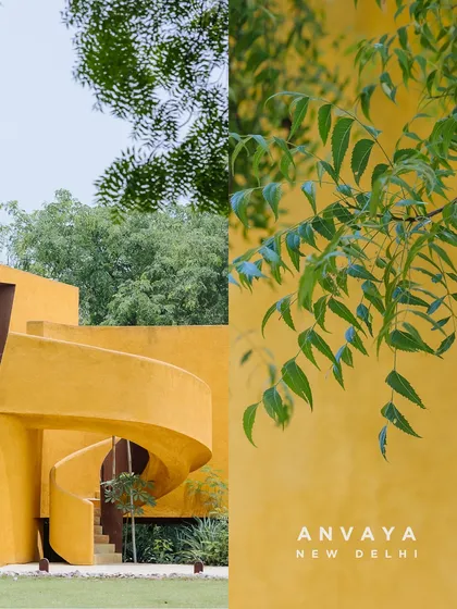 The unique, mustard-yellow spiral staircase of Anvaya, New Delhi, a venue that combines bold architectural design with minimalist aesthetics.