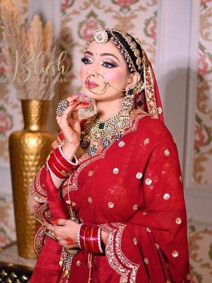 A full-length shot of a student's creation, showing how the makeup complements the entire bridal outfit.