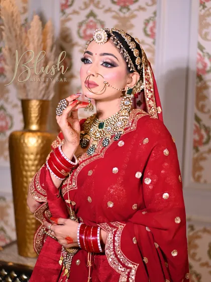 A full-length shot of a student's creation, showing how the makeup complements the entire bridal outfit.