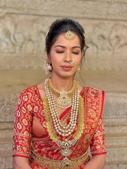 A serene, eyes-closed shot that highlights the flawless eye makeup and glowing skin.