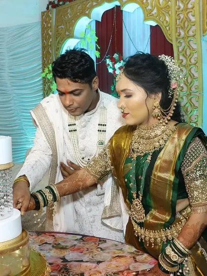 The cake cutting ceremony is a highlight of any celebration. Here, the couple cuts their beautiful swan-themed engagement cake together.
