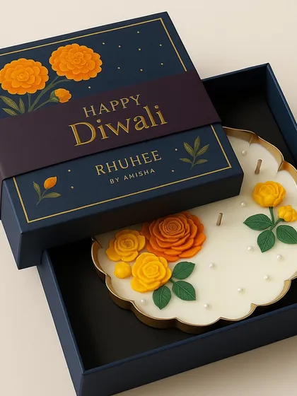 Light up Diwali with this piece of festive art. Our handcrafted floral candle, featuring bright marigolds, is nestled in a royal navy box with a 'Happy Diwali' sleeve, ready to make your celebrations unforgettable.
