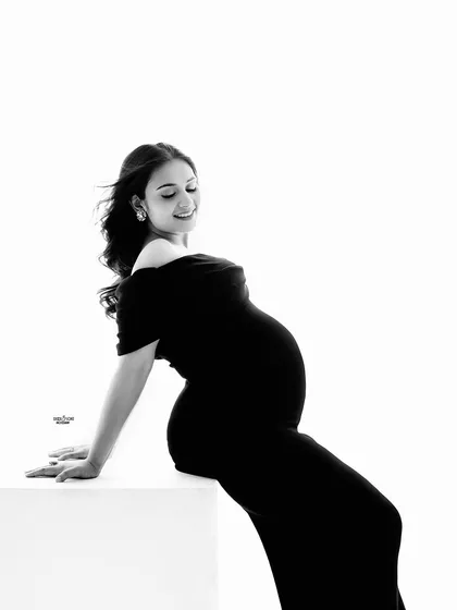 The black and white version of this pose creates a beautiful, high-contrast silhouette that is both artistic and elegant.