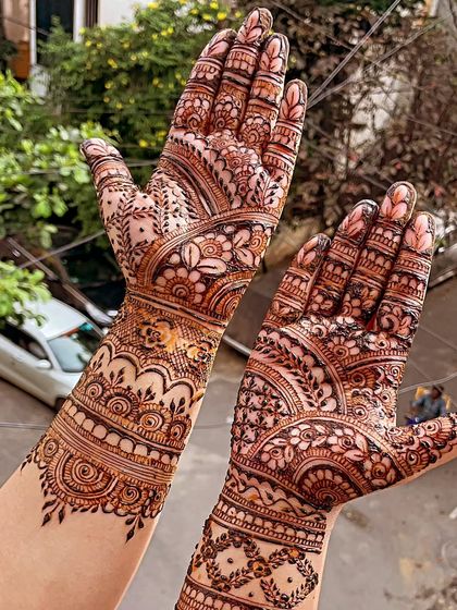 A traditional Indian design with bands of different patterns, including florals and paisleys. The outdoor lighting really brings out the details.