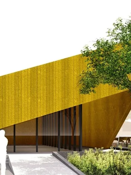 The yellow version of the geometric public building, showing how the form interacts with the surrounding trees and landscape.