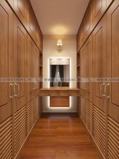 A walk-in closet is a statement of personal luxury and organization. We designed this classic closet with floor-to-ceiling teakwood wardrobes, antique-finish handles, and a central dressing unit with integrated lighting to create a functional and timelessly elegant space.