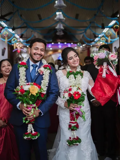 The couple exiting the church, showered with blessings and flower petals. A moment of pure joy.