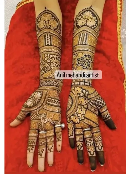 This full-arm design is rich with traditional patterns. It features heart-shaped peacock motifs at the top, followed by bands of floral and geometric designs.