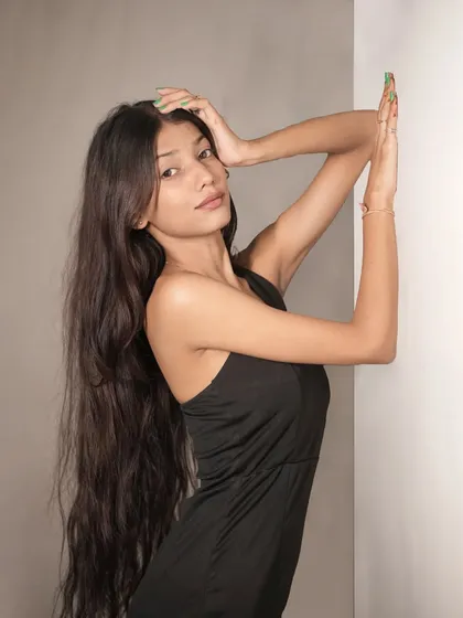 A duplicate of image 77, this artistic pose with raised arms creates elegant lines and a sense of drama.