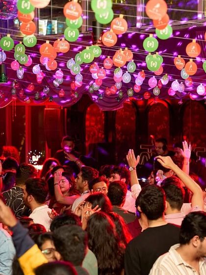 The festive decorations and packed crowd at Sarjapur Social during a holiday-themed night.