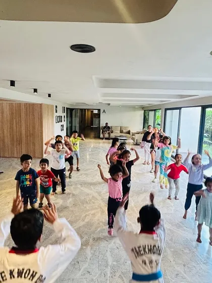 A fun warm-up session with the younger kids, getting them excited and ready for class.