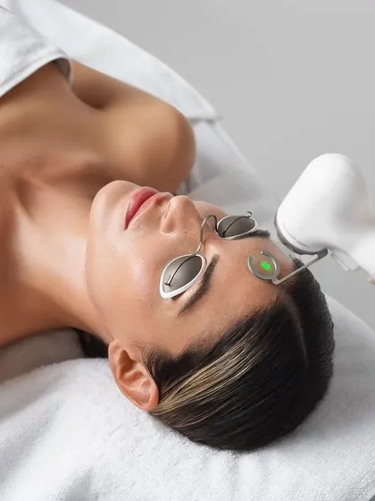 A patient undergoing the AdvaTx laser treatment. The protective eyewear and precise application demonstrate the safety protocols we follow to ensure an effective and comfortable experience.