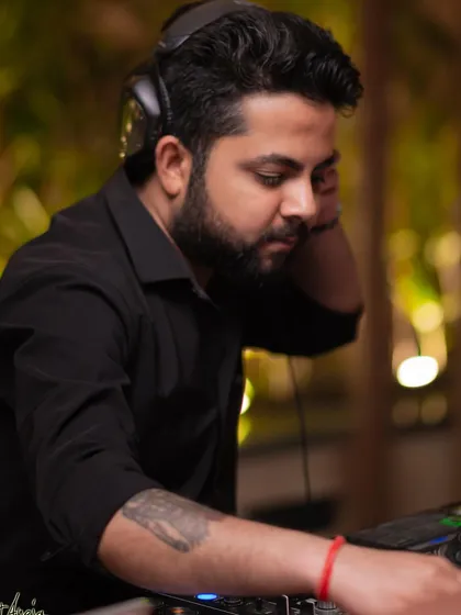 Focused on the mix. A candid shot of me working the Pioneer decks during a busy night at Perissa.
