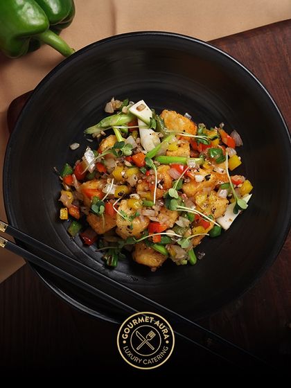 A healthy and colorful bowl of stir-fried prawns and diced vegetables, showcasing our ability to create dishes that are both light and packed with flavor.