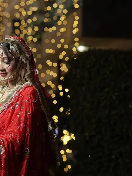 A soft, elegant portrait of the bride. Her gentle smile and the beautiful lighting create a timeless and graceful image.