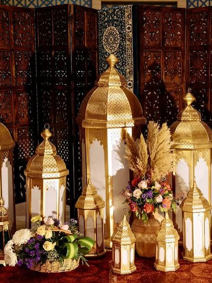 A collection of beautiful Moroccan lanterns and pampas grass arrangements, key decor elements that help build the authentic, vintage bazaar atmosphere.