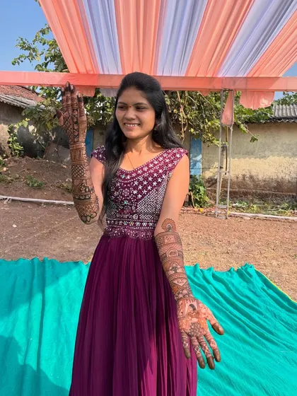 My student proudly displaying her full bridal mehendi, a testament to the skills she learned and the art we created together for her special day.