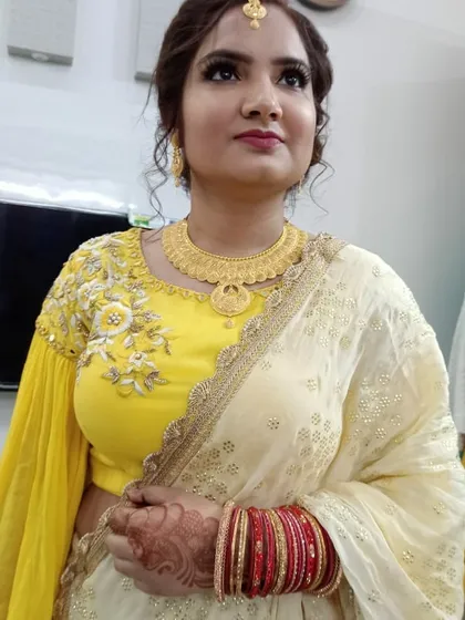 Another angle of this beautiful anniversary look, showing how the makeup looks from the side. The contouring is soft and the updo hairstyle keeps the focus on her face and jewelry.