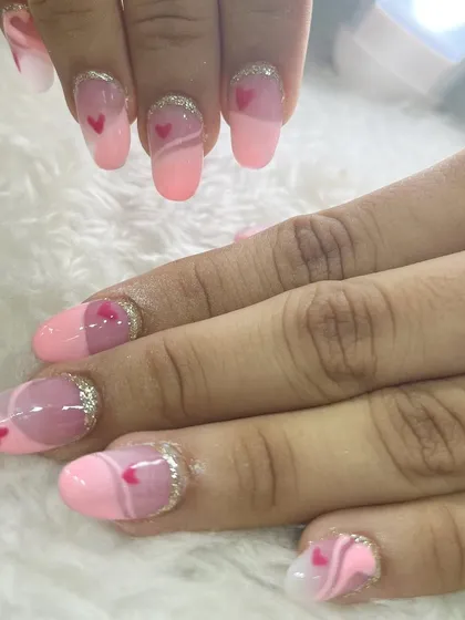 A cute and romantic heart-themed nail set created by one of our students. This showcases their ability to execute themed designs with precision.
