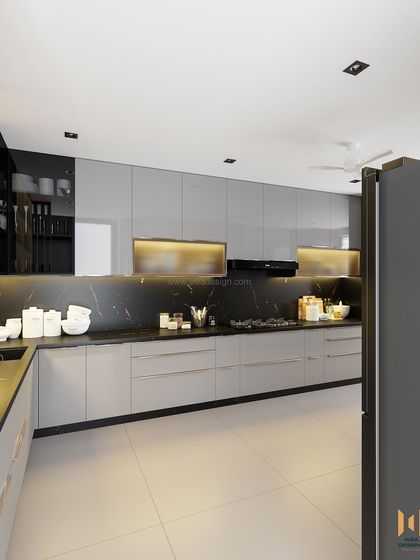 A wide shot of the main kitchen counter, with sleek handleless drawers and warm under-cabinet lighting.