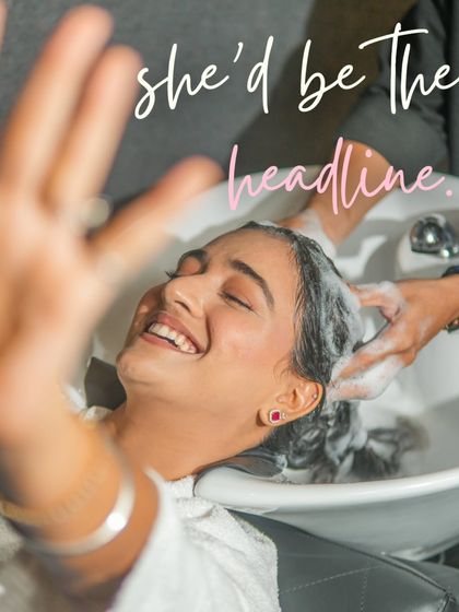 She'd be the headline. A moment of pure joy and relaxation during a hair wash, because feeling good is the first step to looking good.