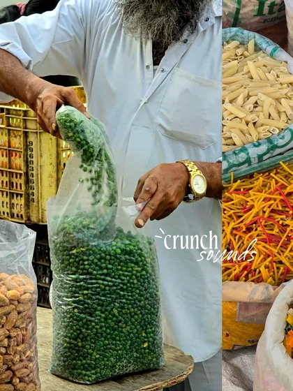 A vendor bagging fresh green peas, a simple, everyday transaction in the market.