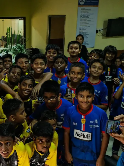 A moment of celebration in the locker room after a U13 match. The bonds formed between teammates are one of the most rewarding parts of the game.