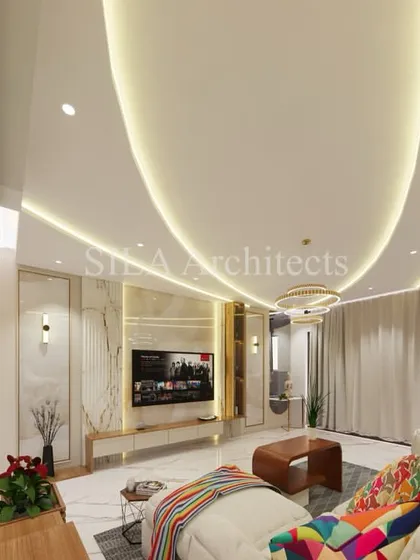 We design living spaces that are both luxurious and livable. This 3D rendering shows a spacious living room with high ceilings, elegant lighting, and a seamless flow into the dining and kitchen areas, creating an atmosphere of open, modern comfort.