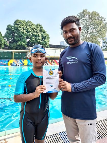 Congratulations to another one of our dedicated students, certificate in hand, for leveling up his swimming skills with his coach by his side.
