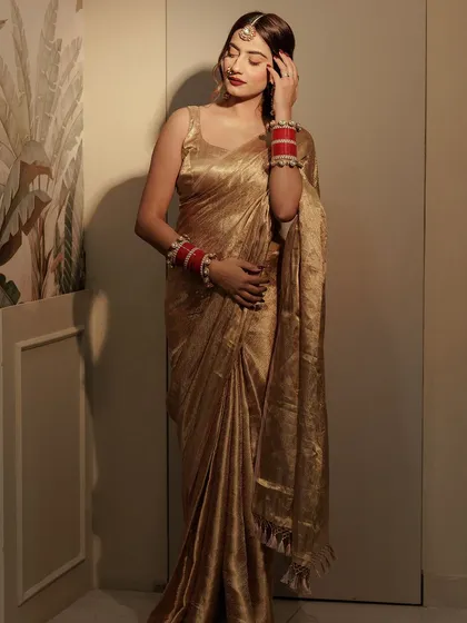 A full-length view of my golden saree look.