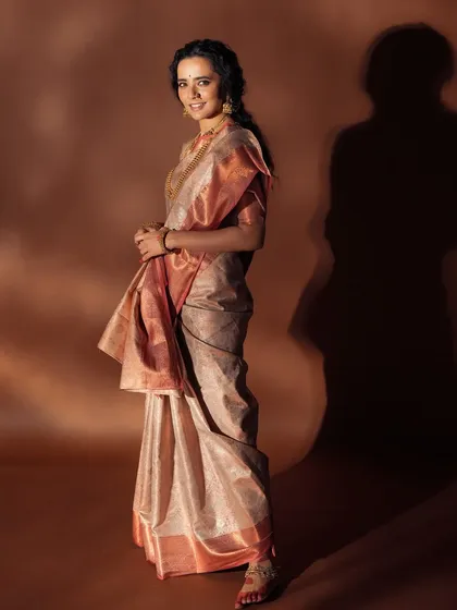 A full-length shot showing how the makeup and styling come together, with dramatic lighting creating a beautiful silhouette.