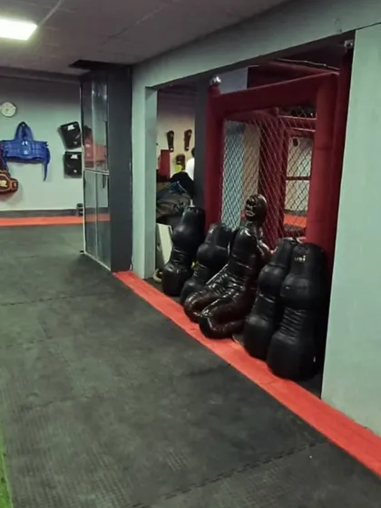 A view of our grappling dummies and protective gear storage. We provide all the necessary equipment, including grappling dummies for solo drills on takedowns and submissions.