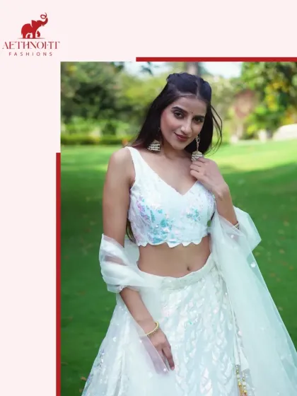 I call this my moonlight lehenga. The soft pastel georgette and delicate sequins catch the light beautifully, making it feel like you're stepping into a dream. It’s super light and flowy, so you can dance the night away.