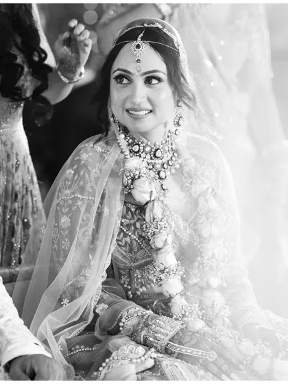 A beautiful black and white portrait of the bride during her ceremony. The soft light and her happy expression create a timeless and angelic look.