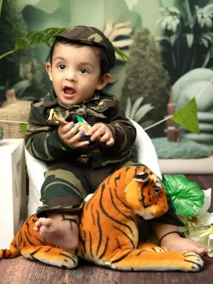 A tiny patriot with the Indian national emblem. These sessions are a wonderful way to instill a sense of pride and create unique family keepsakes.