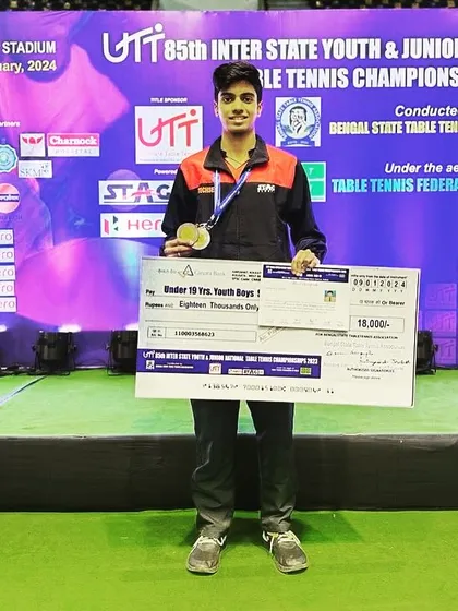 Aakash K J with his prize cheque and medal at the 85th Youth & Junior National Championship, a proud moment for any competitive player.