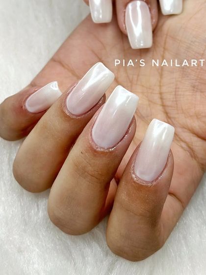 The trending pearl chrome finish, also known as glazed donut nails. It's a simple, clean, and incredibly chic look that goes with everything.