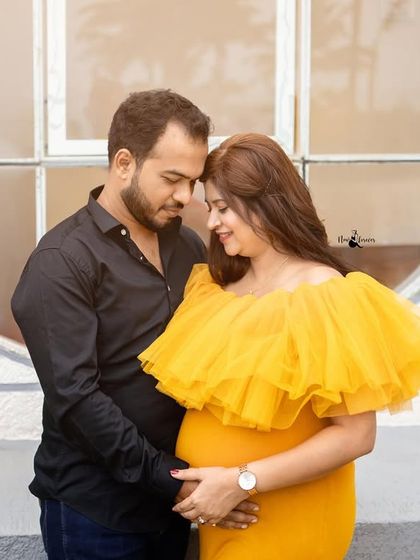 A close-up of the couple, sharing an intimate moment. The soft light and their gentle expressions make this a truly romantic shot.