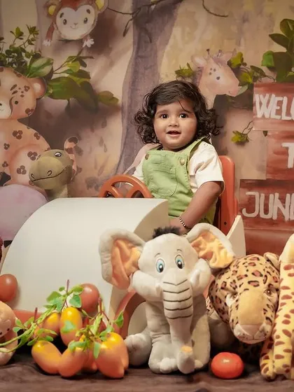 Another example of a themed kids' photoshoot, this time with a 'Welcome to the Jungle' setup. These sessions are all about fun and capturing your child's personality in a playful environment.