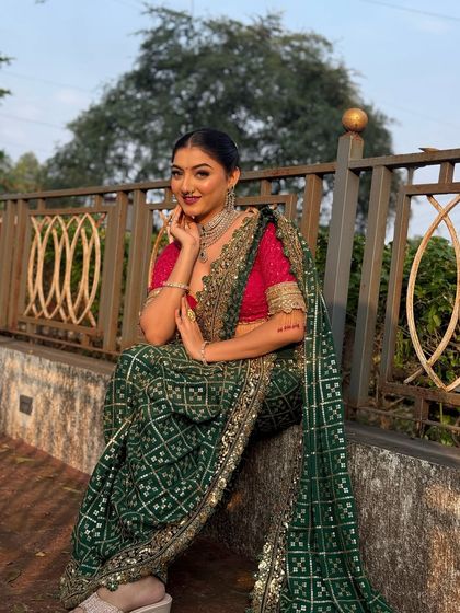 The model looks confident and poised. The sleek bun is a timeless hairstyle that exudes sophistication.