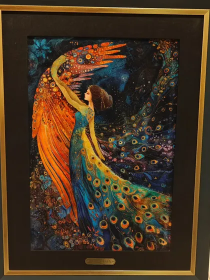 This spectacular carpet art piece depicts a woman with peacock feathers, a magical and vibrant creation that showcases the imaginative potential of the medium.