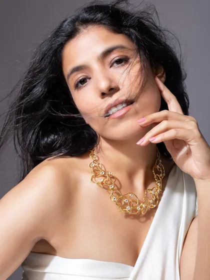 A clean, expressive studio portrait for a modern jewelry campaign. My direction focuses on capturing a natural confidence and ensuring the product shines without overpowering the model's energy.