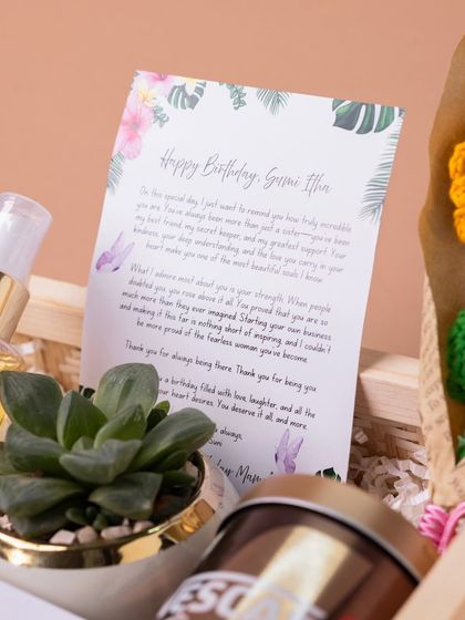 A heartfelt, personalized birthday letter included in the 'Tropical Dream' hamper. A handwritten or custom-printed note adds a deeply personal and emotional touch.